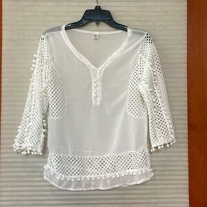 Sheer white top fits more like a size, small medium like new